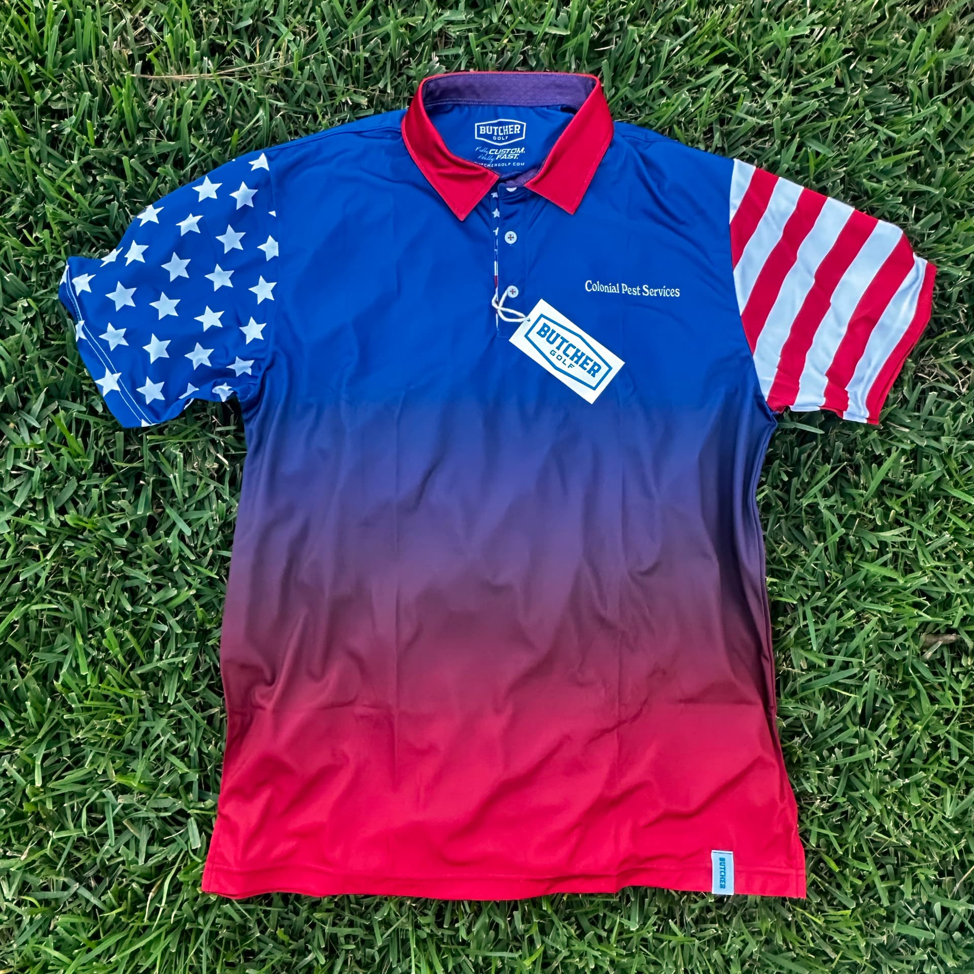Lightweight performance polo with all-over brand pattern suited to long days of standing and conversation.