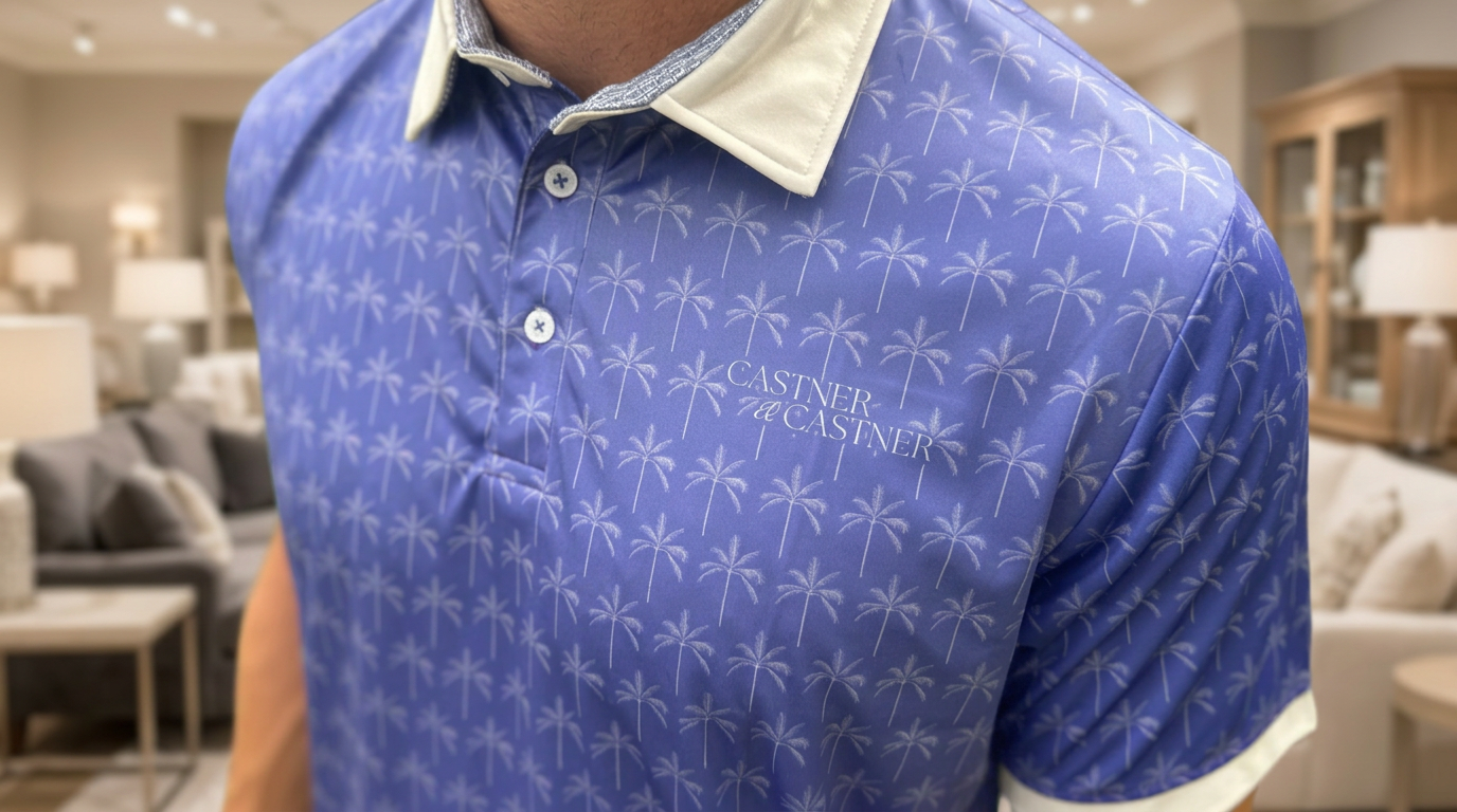 Castner & Castner custom polo with palm tree repeat pattern and chest logo