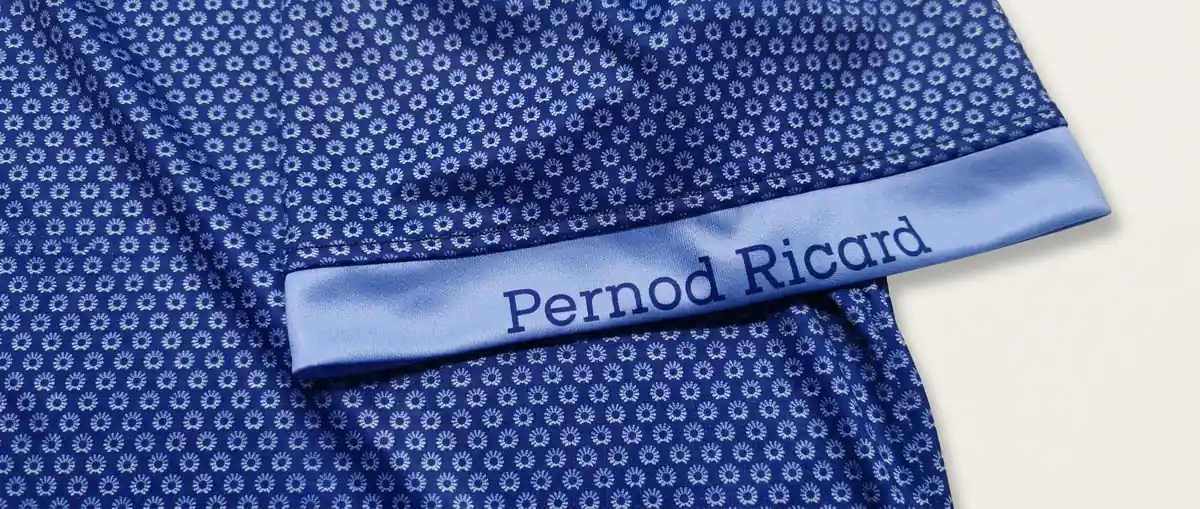 Macro view of a printed pattern continuing intentionally across a seam on lightweight performance fabric.