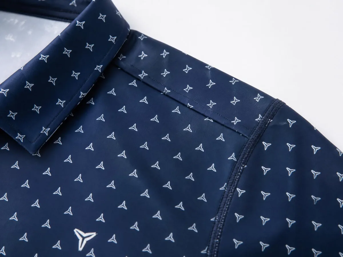 Construction and detail image showing fabric, seams, pattern registration, collar, and logo.