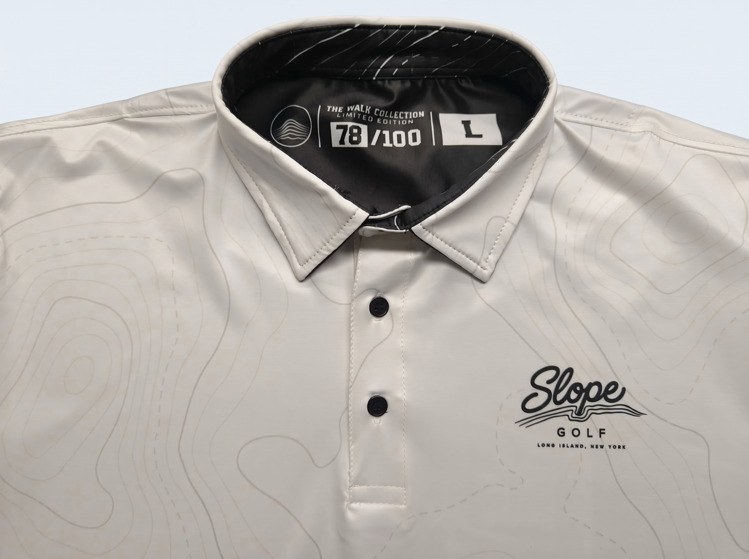 Slope Golf private-label polo — inside-collar imprint view